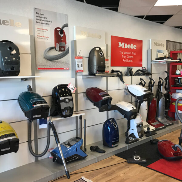 More Than Vacuums Showroom showing upright and canister Miele vacuums