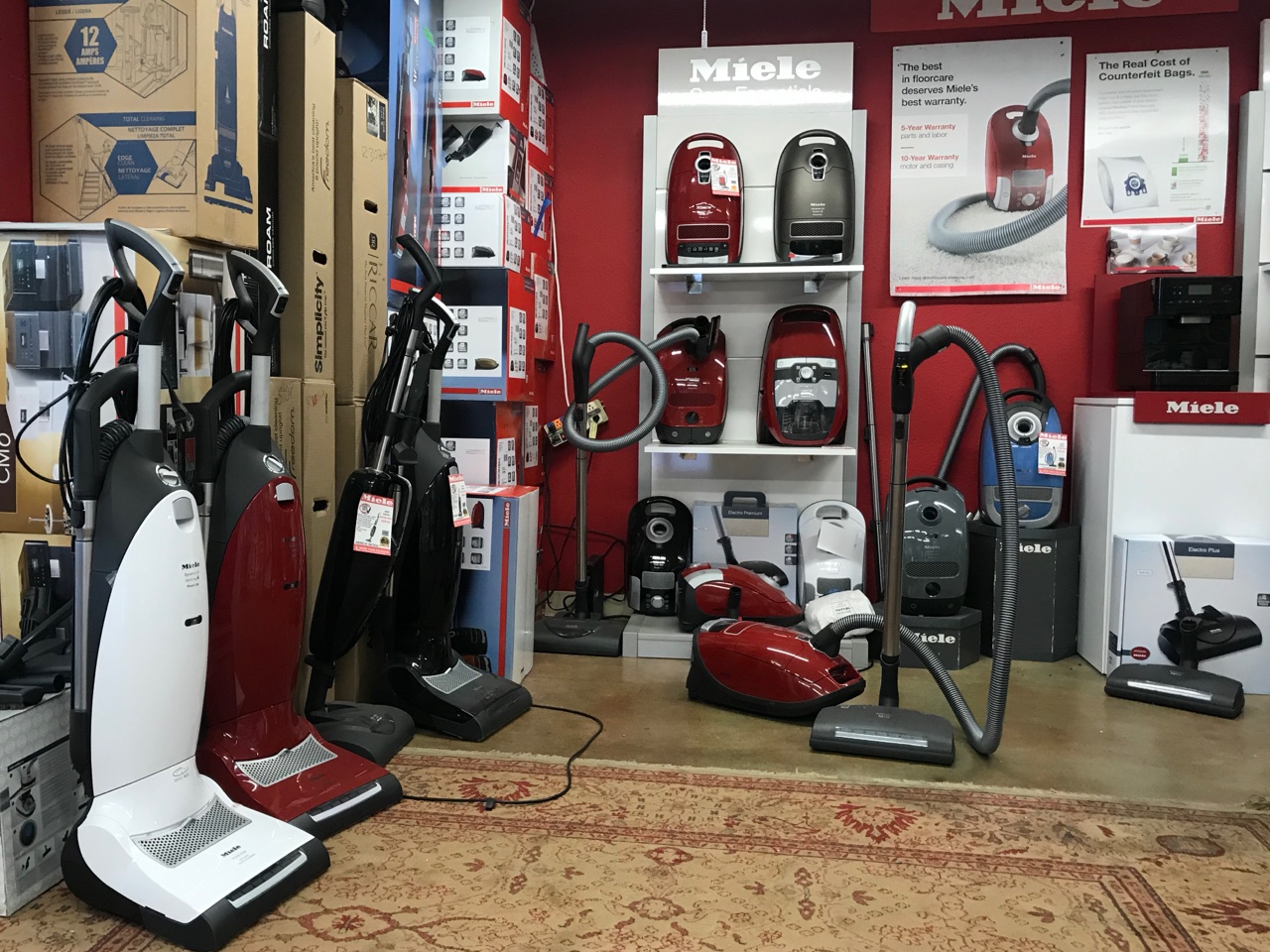 More Than Vacuums Denver locations showroom showing Miele upright and canister vacuums